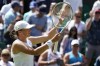 Poland's Iga Swiatek celebrates after beating Croatia's Jana Fett in a first round women's singles match on day two of the Wimbledon tennis championships in London, Tuesday, June 28, 2022. (AP Photo/Alberto Pezzali)