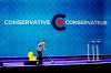 A woman cleans the stage at Conservative leader Erin O'Toole's election night headquarters during the Canadian federal election in Oshawa, Ont., on September 20, 2021. The Conservatives have confirmed about 675,000 members signed up to vote for a new leader, a staggering number that the Tories believe sets an all-time record for any federal political party. THE CANADIAN PRESS/Adrian Wyld