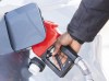 A man pumps gas in Montreal, Friday, March 4, 2022. Gasoline prices have dropped about 12 cents a litre overnight in Ontario and are down across much of Canada after a big dip in the price of oil this week. THE CANADIAN PRESS/Graham Hughes