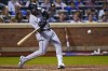 Miami Marlins' Bryan De La Cruz hits a double against the New York Mets during the seventh inning of a baseball game Friday, July 8, 2022, in New York. (AP Photo/Frank Franklin II)