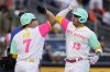 San Diego Padres' Manny Machado (13) celebrates with teammate Ha-Seong Kim (7) after hitting a three-run home run during the first inning of a baseball game Friday, July 8, 2022, in San Diego. (AP Photo/Gregory Bull)