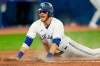 Toronto Blue Jays catcher Danny Jansen (9) celebrates as he slides into home plate for the go ahead run during sixth inning American League baseball action against the Texas Rangers in Toronto on April 8, 2022. The Blue Jays reinstated Jansen from the 10-day injured list on Tuesday and optioned fellow catcher Gabriel Moreno to Triple-A Buffalo. THE CANADIAN PRESS/Frank Gunn