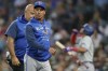 Toronto Blue Jays manager Charlie Montoyo walks with a trainer after Bradley Zimmer was hit by a pitch during the seventh inning of the team's baseball game against the Seattle Mariners on July 7, 2022, in Seattle. THE CANADIAN PRESS/AP, Ted S. Warren