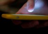 In this Aug. 11, 2019, file photo, a man uses a cell phone in New Orleans. Pressure is mounting for Canada to establish a three-digit suicide crisis hotline, similar to the one implemented by the United States this weekend. THE CANADIAN PRESS/AP/Jenny Kane