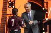 MLB Commissioner Rob Manfred, right, shakes hands with Willa suarez, of Uvalde, Tex., during the 2022 MLB baseball draft, Sunday, July 17, 2022, in Los Angeles. (AP Photo/Abbie Parr)