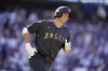 American League's Shohei Ohtani, of the Los Angeles Angels, smiles as he round first base with a single during the first inning of the MLB All-Star baseball game against the American League, Tuesday, July 19, 2022, in Los Angeles. (AP Photo/Abbie Parr)