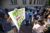 Guests hold signs and listen to speakers during the Hoosier Conservative Voices rally supporting overturning Roe v. Wade Monday, June 27, 2022 near the Robert A. Grant Federal Building & U.S. Courthouse in downtown South Bend, Ind. (Michael Caterina/South Bend Tribune via AP)