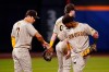 San Diego Padres' Ha-Seong Kim (7), of South Korea, and Jake Cronenworth (9) celebrate after a baseball game against the New York Mets, Saturday, July 23, 2022, in New York. The Padres won 2-1. (AP Photo/Frank Franklin II)