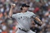 New York Yankees pitcher Gerrit Cole throws to a Baltimore Orioles batter during the first inning of a baseball game Saturday, July 23, 2022, in Baltimore.(AP Photo/Gail Burton)