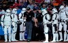 Umpires Andy Fletcher, left, and Junior Valentine are flanked by 