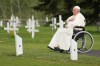 Pope Francis prays at a gravesite at the Ermineskin Cree Nation Cemetery in Maskwacis, Alta., during his papal visit across Canada on Monday, July 25, 2022. Pope Francis delivered a historic apology to survivors of the country's residential school system, the majority of which were operated by the Catholic Church. THE CANADIAN PRESS/Nathan Denette