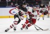 Canada's Lukas Cormier (6) and Austria's Fin van Ee (15) battle for the puck during first period IIHF World Junior Hockey Championship action in Edmonton on Tuesday, December 28, 2021. Embattled Hockey Canada president and chief executive officer Scott Smith says his organization will fulfil its duty as host at next month's world junior hockey tournament in Edmonton.THE CANADIAN PRESS/Jason Franson