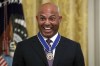 FILE - Former New York Yankees baseball pitcher Mariano Rivera smiles after being presented the Presidential Medal of Freedom by President Donald Trump in the East Room of the White House on Sept. 16, 2019, in Washington. Rivera and ex-Cincinnati Reds shortstop Barry Larkin are leading a push to bring the sport that made them famous to India, Pakistan and the Middle East. (AP Photo/Patrick Semansky, File)