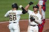 Pittsburgh Pirates' Cal Mitchell, right, celebrates with Bligh Madris after hitting a two-run home run off Philadelphia Phillies starting pitcher Zack Wheeler during the seventh inning of a baseball game in Pittsburgh, Thursday, July 28, 2022. (AP Photo/Gene J. Puskar)