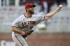 Arizona Diamondbacks starting pitcher Madison Bumgarner throws to an Atlanta Braves batter during the first inning of a baseball game Friday, July 29, 2022, in Atlanta. (AP Photo/Brett Davis)