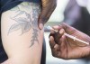 A man receives a monkeypox vaccine at an outdoor walk-in clinic in Montreal, Saturday, July 23, 2022. Quebec is expanding access to the monkeypox vaccine amid signs that the virus has begun to spread outside Montreal.THE CANADIAN PRESS/Graham Hughes