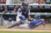 Minnesota Twins catcher Gary Sanchez tags out Toronto Blue Jays' Whit Merrifield who tags from third on a sacrifice fly by Cavan Biggio in the tenth inning of a baseball game Sunday, Aug. 7, 2022, in Minneapolis. The play was overturned on review due to the catcher blocking the plate and the Blue Jays won 3-2 in 10. (AP Photo/Bruce Kluckhohn)