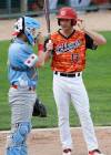 JOHN WOODS / WINNIPEG FREE PRESS
                                Winnipeg Goldeyes slugger Max Murphy chats with Chicago Dogs catcher Ryan Lidge Tuesday during the clubs&rsquo; match at Shaw Field.