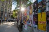 Show posters cover the fence at the outdoor stage at Old Square Market for the Fringe Theatre Festival in Winnipeg, Manitoba. (Ethan Cairns / Winnipeg Free Press)