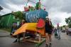 Participants of the Art City Parade pull a giant fruit salad bowl at the start of the parade on Saturday. (Ethan Cairns / Winnipeg Free Press)