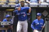 Toronto Blue Jays' Zack Collins is helped into the team's home run jacket by teammate Raimel Tapia after hitting a home run against the Kansas City Royals during the third inning of a baseball game in Kansas City, Mo., Wednesday, June 8, 2022.&nbsp;Collins was recalled by the Toronto Blue Jays from their triple-A affiliate in Buffalo, N.Y., on Saturday. THE CANADIAN PRESS/AP-Reed Hoffmann