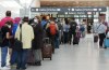 People line up before entering the security at Pearson International Airport in Toronto on Friday, August 5, 2022. The House of Commons transport committee is holding an emergency meeting today to talk about whether to go ahead with an investigation into airport delays and flight cancellations.THE CANADIAN PRESS/Nathan Denette