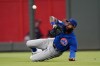 FILE - Chicago Cubs right fielder Jason Heyward makes a diving catch on a fly ball by Atlanta Braves' Austin Riley in the third inning of a baseball game April 28, 2021, in Atlanta. The Cubs will cut ties with Heyward after this season, ending one of baseball’s most expensive and unproductive free-agent signings with a year left on his contract. (AP Photo/John Bazemore, File)