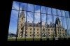 The West Block of Parliament Hill is pictured through the window of the Sir John A Macdonald building in Ottawa on Wednesday, May 11, 2022. Hundreds of scientists and researchers are expected to gather on Parliament Hill today to call for a raise. THE CANADIAN PRESS/Sean Kilpatrick