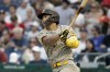 San Diego Padres' Ha-Seong Kim follows through on a ground rule double during the second inning of a baseball game against the Washington Nationals, Saturday, Aug.13, 2022, in Washington. (AP Photo/Luis M. Alvarez)