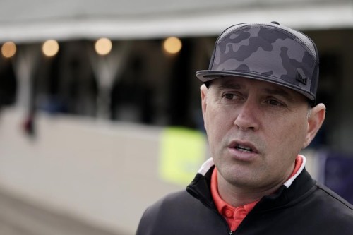 FLE - Horse trainer Chad Brown talks to the media after a workout by Kentucky Derby entrant Zandon at Churchill Downs on May 3, 2022, in Louisville, Ky. Brown, a prominent New York-based horse trainer whose Early Voting won this year's Preakness Stakes, is facing a domestic violence charge for allegedly pushing a woman down a flight of stairs and trying to choke her, authorities said Thursday, Aug. 18, 2022. (AP Photo/Charlie Riedel, File)