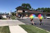 Volunteer escorts and others stand outside the Red River Women's Clinic in Moorhead, Minn., Wednesday, Aug. 10, 2022. The clinic has operated since 1998 in Fargo, where it was North Dakota's only abortion clinic, but now faces likely shutdown on a trigger law banning abortion due to take effect in late August. Wednesday was its first day of operation just a couple of miles away at the new Moorhead location. (AP Photo/Dave Kolpack)