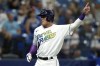 Tampa Bay Rays' Yu Chang scores on an RBI double by Taylor Walls off Kansas City Royals starting pitcher Kris Bubic during the second inning of a baseball game Saturday, Aug. 20, 2022, in St. Petersburg, Fla. (AP Photo/Chris O'Meara)