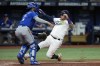 Tampa Bay Rays' Harold Ramirez, right, beats the throw to Kansas City Royals catcher MJ Melendez (1) to score on a sacrifice fly by Yu Chang during the eighth inning of a baseball game Saturday, Aug. 20, 2022, in St. Petersburg, Fla. (AP Photo/Chris O'Meara)