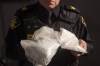 An OPP officer displays bags containing fentanyl as Ontario Provincial Police host a news conference in Vaughan, Ont., on February 23, 2017. Opioids have killed more people in Ontario in the second year of the pandemic compared to the first, but there was a drop in deaths in March, newly released data shows, giving the chief coroner some hope that trend continues. The deadly drugs continue to kill people at a much higher rate in the province's north compared to the south. And opioids are also killing young people, specifically men aged 25 to 44, more than other age groups, the data shows. THE CANADIAN PRESS/Chris Young