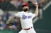 Texas Rangers starting pitcher Dallas Keuchel throws to the Detroit Tigers in the first inning of a baseball game in Arlington, Texas, Saturday, Aug. 27, 2022. (AP Photo/Tony Gutierrez)