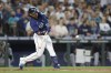 Seattle Mariners' Eugenio Suarez hits a solo home run on a pitch from Cleveland Guardians starter Zach Plesac during the second inning of a baseball game, Saturday, Aug. 27, 2022, in Seattle. (AP Photo/John Froschauer)