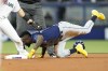 Tampa Bay Rays' Randy Arozarena is safe with a steal of second during the first inning of the team's baseball game against the Miami Marlins, Wednesday, Aug. 31, 2022, in Miami. (AP Photo/Lynne Sladky)