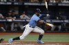 Tampa Bay Rays' Yandy Diaz hits a two-RBI single to center against the New York Yankees during the third inning of a baseball game Saturday, Sept. 3, 2022, in St. Petersburg, Fla. (AP Photo/Scott Audette)