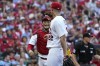St. Louis Cardinals catcher Yadier Molina, left, smiles as he walks off the field with starting pitcher Jack Flaherty after retiring the Washington Nationals during the fourth inning of a baseball game Monday, Sept. 5, 2022, in St. Louis. (AP Photo/Jeff Roberson)