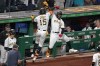 Pittsburgh Pirates' Oneil Cruz (15) celebrates with Rodolfo Castro as he returns to the dugout after hitting a two-run home run off New York Mets relief pitcher Tommy Hunter during the eighth inning of a baseball game in Pittsburgh, Tuesday, Sept. 6, 2022. The Pirates won 8-2. (AP Photo/Gene J. Puskar)