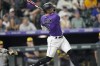 Colorado Rockies' Randal Grichuk watches his three-run home run off Milwaukee Brewers relief pitcher Taylor Rogers during the 10th inning of a baseball game Tuesday, Sept. 6, 2022, in Denver. (AP Photo/David Zalubowski)