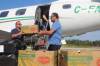 MAGGIE MACINTOSH / WINNIPEG FREE PRESS
                                Vince Barletta, CEO of Harvest Manitoba (left) and Jason Stevens, northern program officer for Food Banks Canada, unload food donations for St. Theresa Point First Nation from Winnipeg.