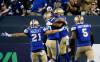 Winnipeg Blue Bombers&rsquo; Jackson Jeffcoat (94), right, celebrates his touchdown from a fumble recovery against the Calgary Stampeders during the second half CFL action in Winnipeg Thursday, August 25, 2022. The play was called back for roughing the passer. THE CANADIAN PRESS/John Woods