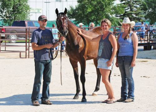 George Williams Photo
                                Breeder Kelly Halliday (left), with sales topper Hip #15, wife Kim and her sister Emily Lesy.