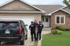 Police were removing evidence from a home on Creekside Drive in Steinbach last week. (Tyler Searle / Winnipeg Free Press)