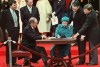 The Queen signs Canada's constitutional proclamation in Ottawa on April 17, 1982 as Prime Minister Pierre Trudeau looks on. THE CANADIAN PRESS/Ron Poling