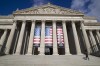 FILE - People walk up the steps even though the National Archives is closed with the partial government shutdown, Dec. 22, 2018 in Washington. While the Archives safeguards precious national documents such as the Declaration of Independence, the Constitution and the Bill of Rights, that's only the public face of their sprawling collection, which spans 13 billion pages of text and 10 million maps, charts and drawings, as well as tens of millions of photographs, films and other records. (AP Photo/Alex Brandon, File)