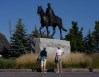 Two women stop to view a statue of Queen Elizabeth near Rideau Hall in Ottawa, Thursday, Sept.8, 2022. Most Canadians have never known a world in which the Queen wasn't their official head of state. THE CANADIAN PRESS/Adrian Wyld