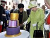 FILE - Britain's Queen Elizabeth II cuts into a birthday cake baked by Nadiya Hussain, left, winner of the Great British Bake Off, during celebrations of her 90th birthday in Windsor, England, Thursday April 21, 2016. Queen Elizabeth II, Britain’s longest-reigning monarch and a rock of stability across much of a turbulent century, has died. She was 96. Buckingham Palace made the announcement in a statement on Thursday Sept. 8, 2022. (John Stillwell/Pool via AP, File)