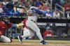 New York Mets' Eduardo Escobar (10) single to right field during the second inning of a baseball game against the Miami Marlins, Saturday, Sept. 10, 2022, in Miami. (AP Photo/Marta Lavandier)